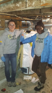 Juliet and Kamene wrapping a water tank